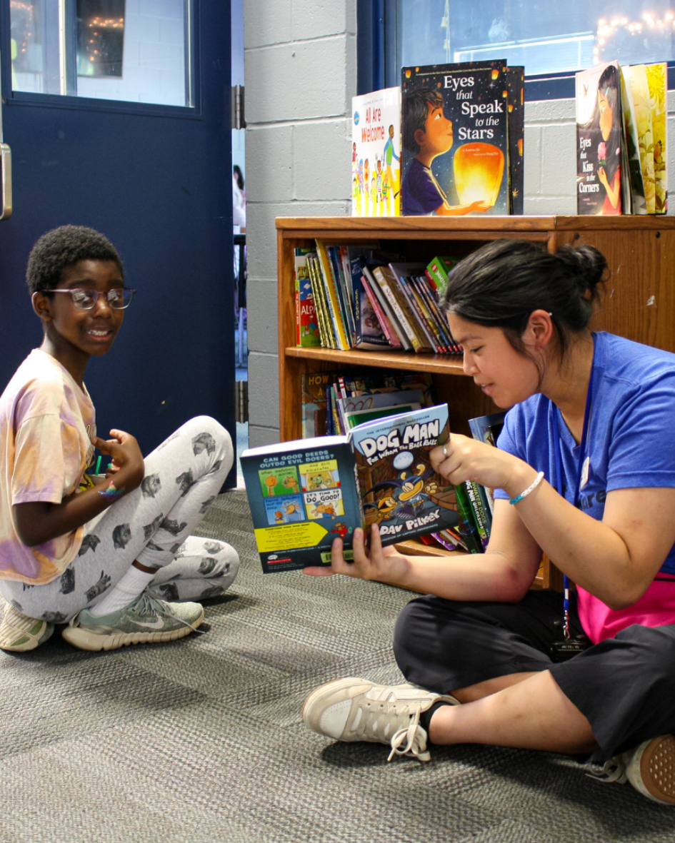 website images (1) A youth development professional at the Boys & Girls Clubs of Whatcom County reads to a Club kid